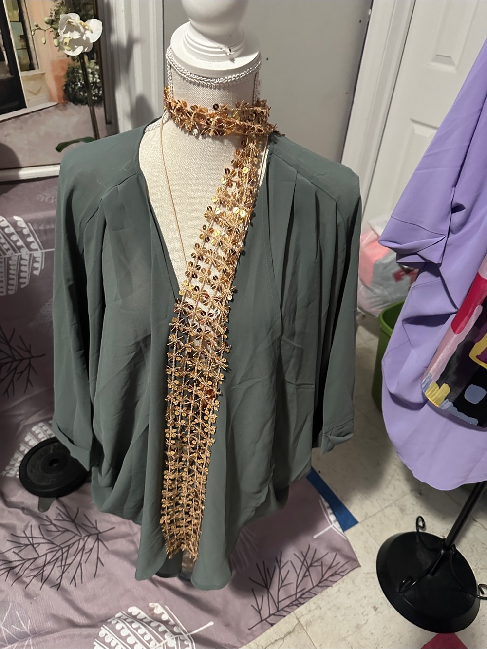 Olive Green Draped Blouse with Gold Floral Necklace Accent